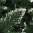 Kunstkerstboom met dennenappels en wit glitter 150 cm